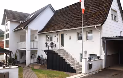 Grundstück bebaut mit Wohnhaus A, Wohnhaus B, Carport in Gasse  7, 7a, 97773 Aura - Bild 1