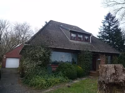 Einfamilienhaus, Einfamilienhaus mit Grünlandflächen in Stollhammer Deich 7, 26969 Butjadingen, Stollhamm - Bild 1