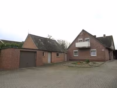 Doppelhaushälfte, mit Nebengebäude und Garage in Dorfstraße 13, 26409 Wittmund, Uttel - Bild 1
