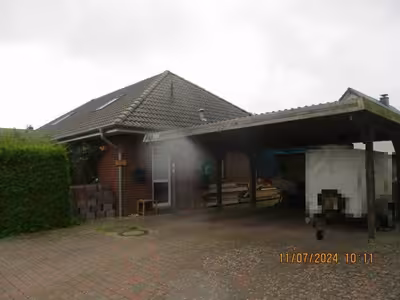 Einfamilienhaus mit Doppelcarport und 2 Gartenhäusern in Eichenkratt 27, 24887 Silberstedt - Bild 1