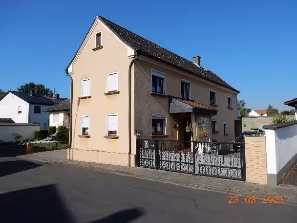 Einfamilienhaus, unbebautes Gartenland in Büdesheim - Bild 1