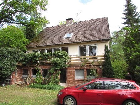 Garage, Einfamilienhaus, unbebautes Waldgrundstück in Köln - Bild 1