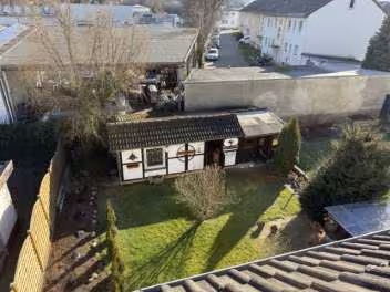 Mit einem Dreifamilienwohnhaus (in der Bauart einer Doppelhaushälfte) mit Garage bebautes Grundstück in Paderborn - Bild 4